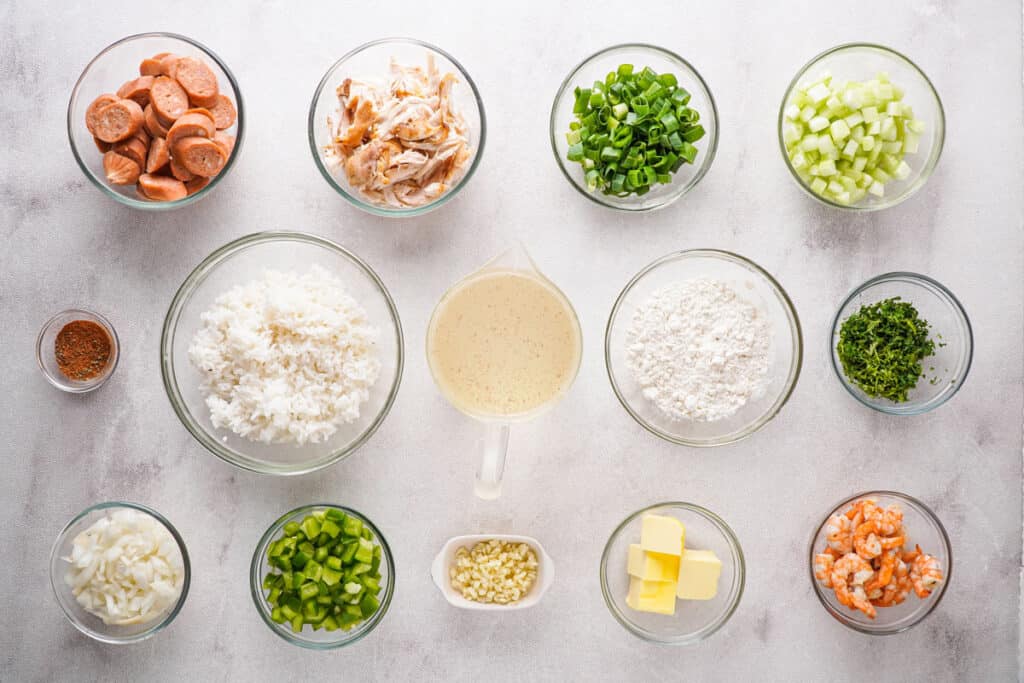 gumbo ingredients in glass bowls