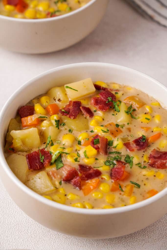 white bowl with corn chowder with bacon