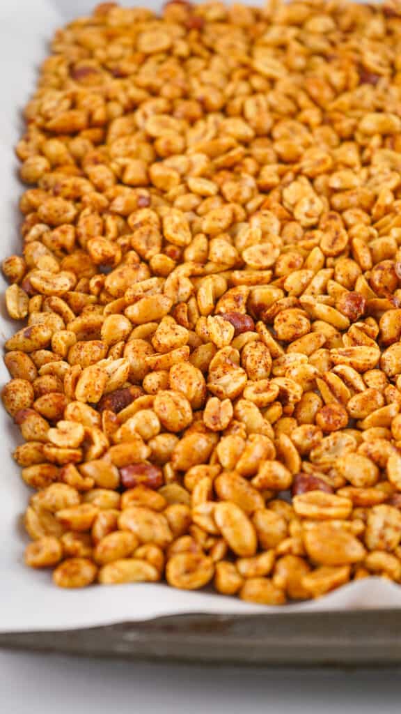 spicy peanuts on baking sheet