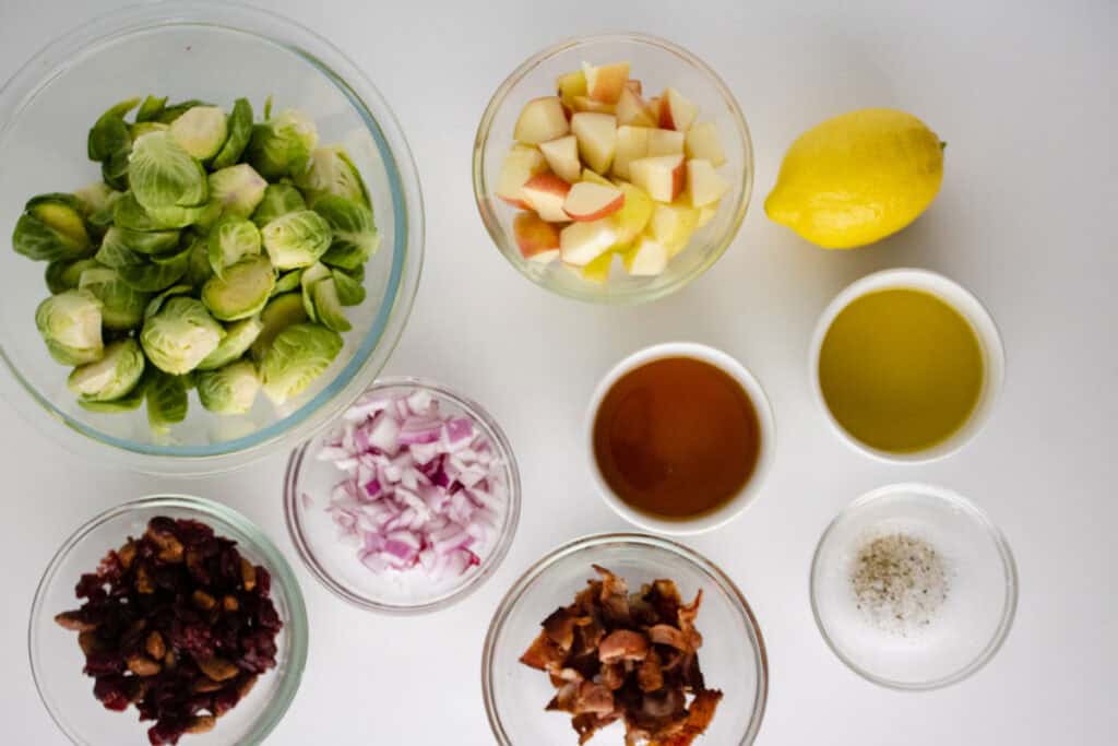 brussels sprouts salad ingredients in bowls on counter