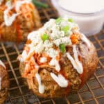 buffalo chicken baked potatoes on wire rack