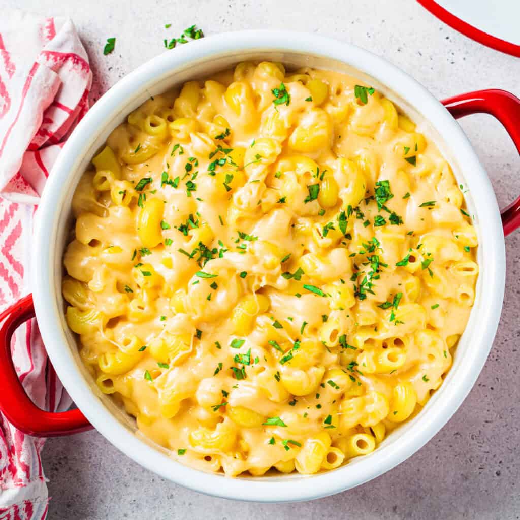 mac and cheese in red and white pot