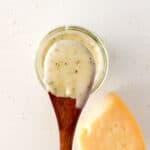 garlic parmesan sauce in spoon