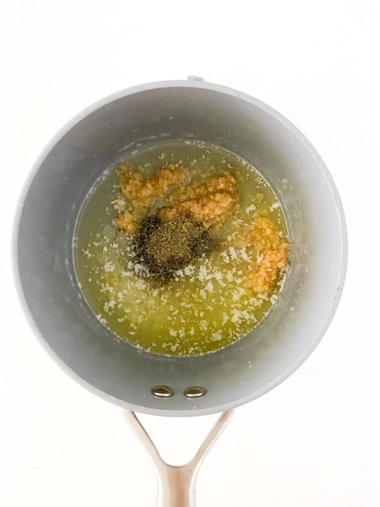 making garlic parmesan sauce in pot