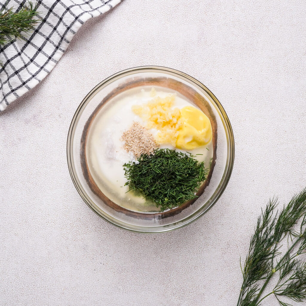 Shrimp salad dressing ingredients in glass bowl