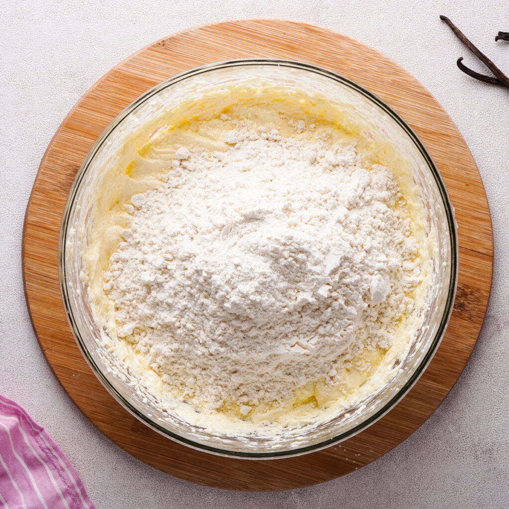 bowl of batter with flour on top