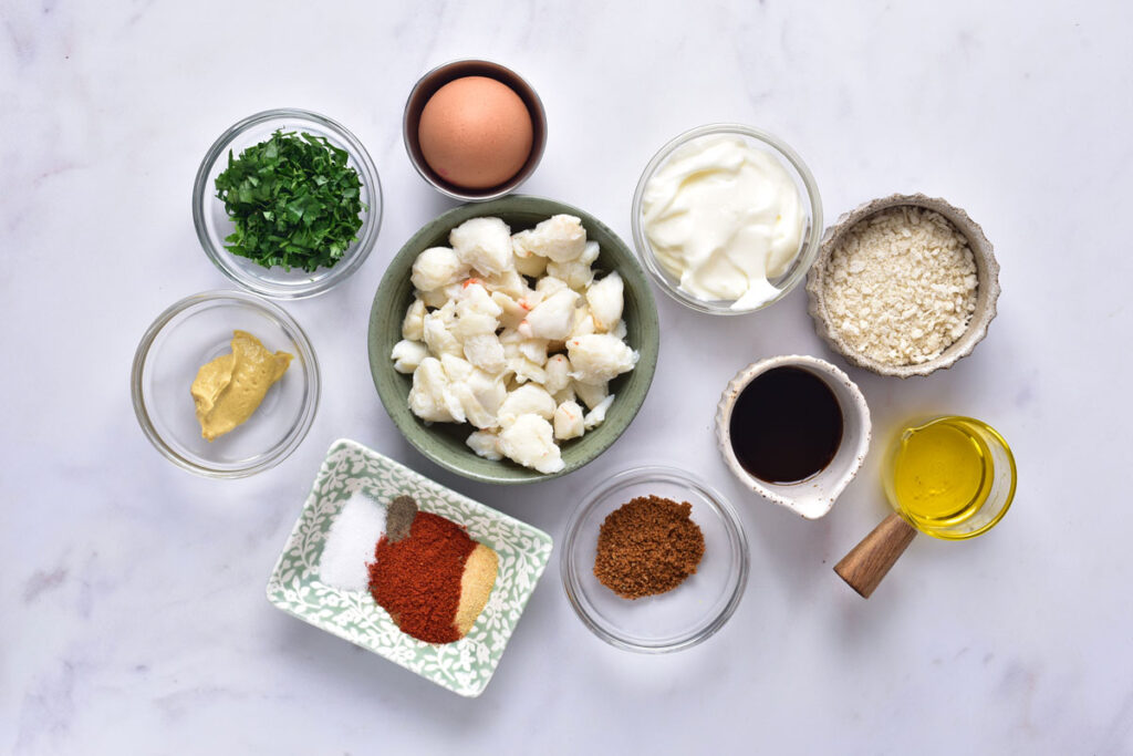 crab cake ingredients in bowls on countertop