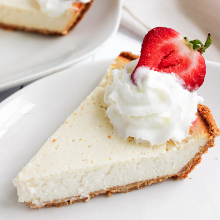 slice of Greek yogurt cheesecake with whipped cream and strawberry