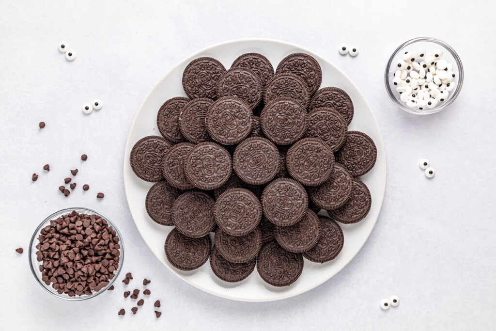 oreos, chocolate chips, and candy eyes on plates