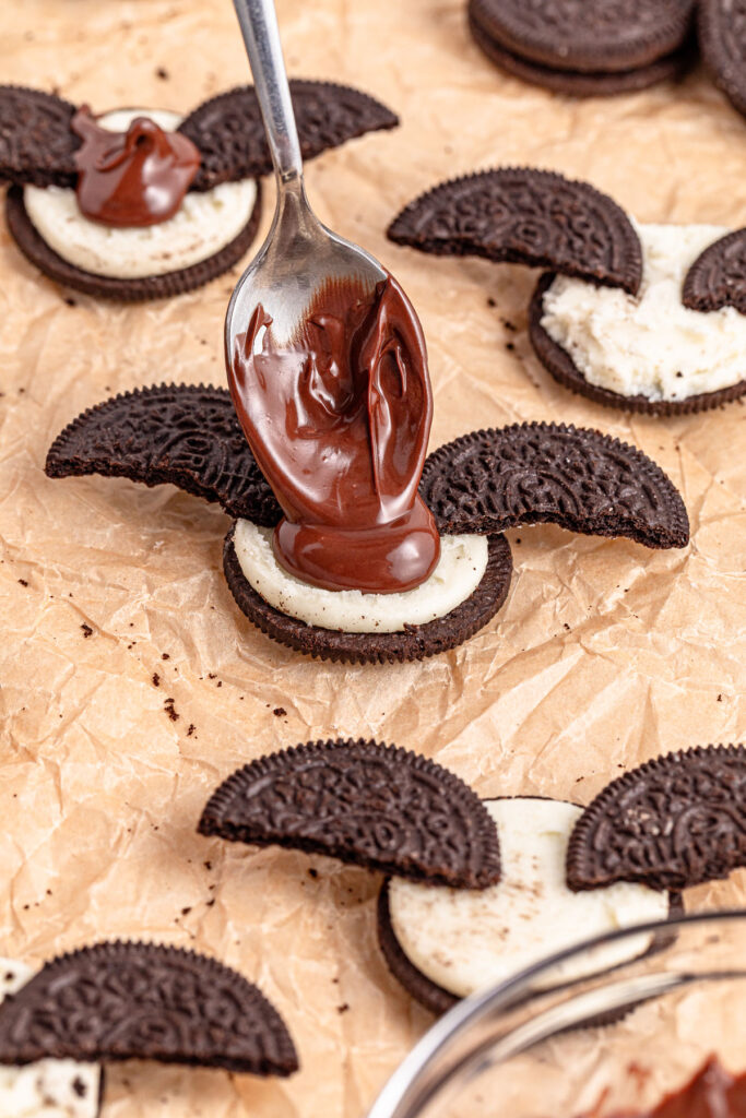 spooning chocolate or oreo to make oreo bats