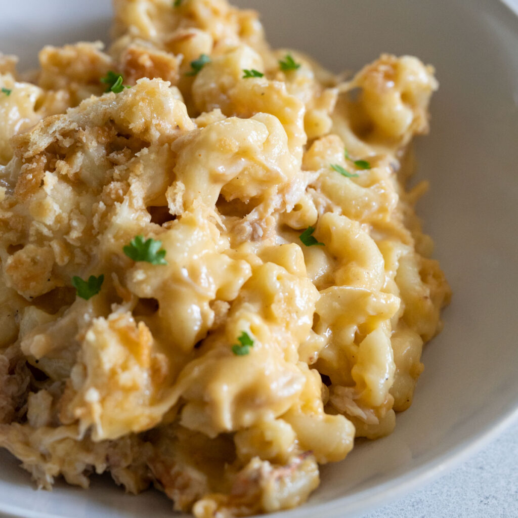 close up of crab mac and cheese in white bowl