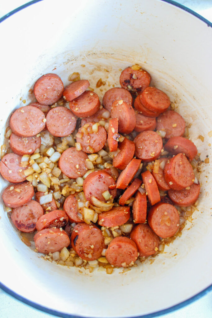 browning sausage and onions in dutch oven