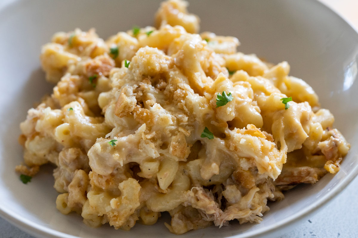 Crab mac and cheese in white bowl.