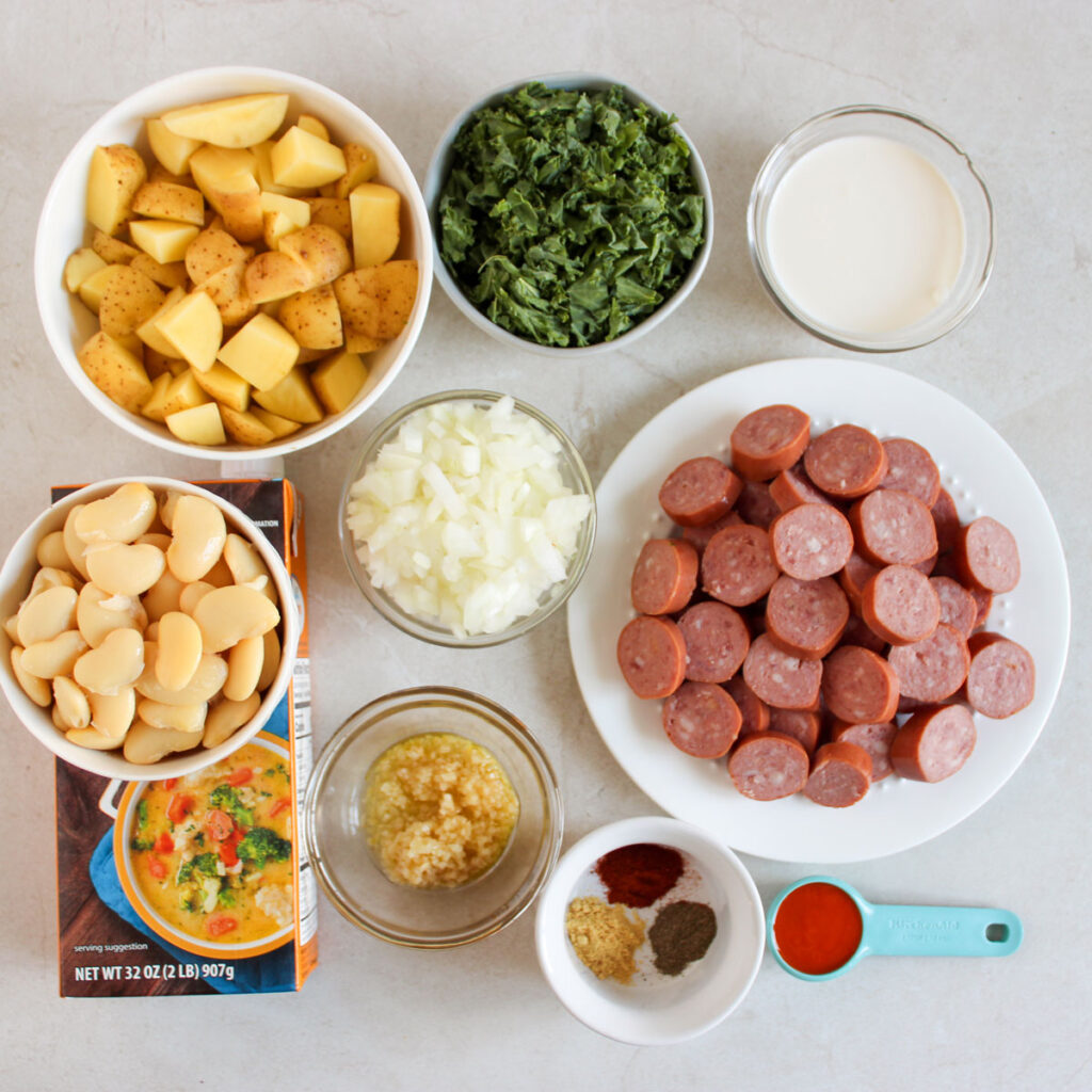 sausage potato kale soup ingredients in bowls