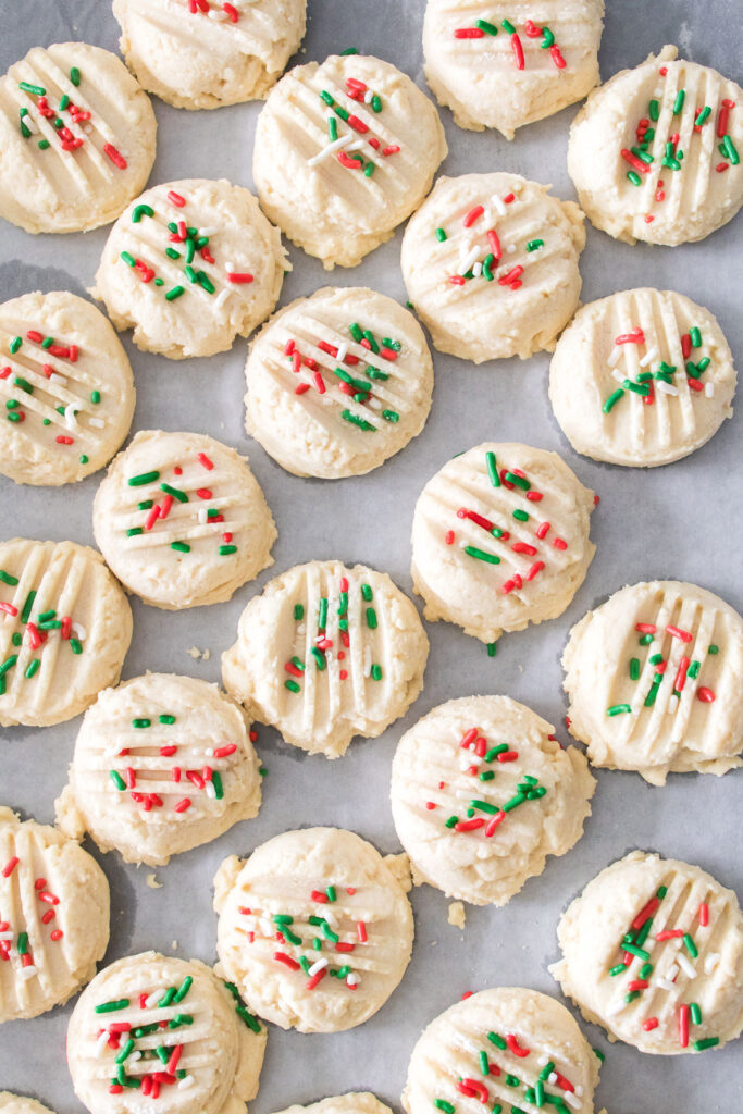 whipped shortbread cookies on parchment paper
