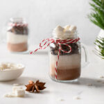 two glass mugs with hot cocoa