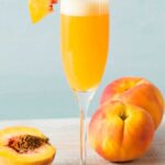 Bellini in champagne flute with cocktail name overlay