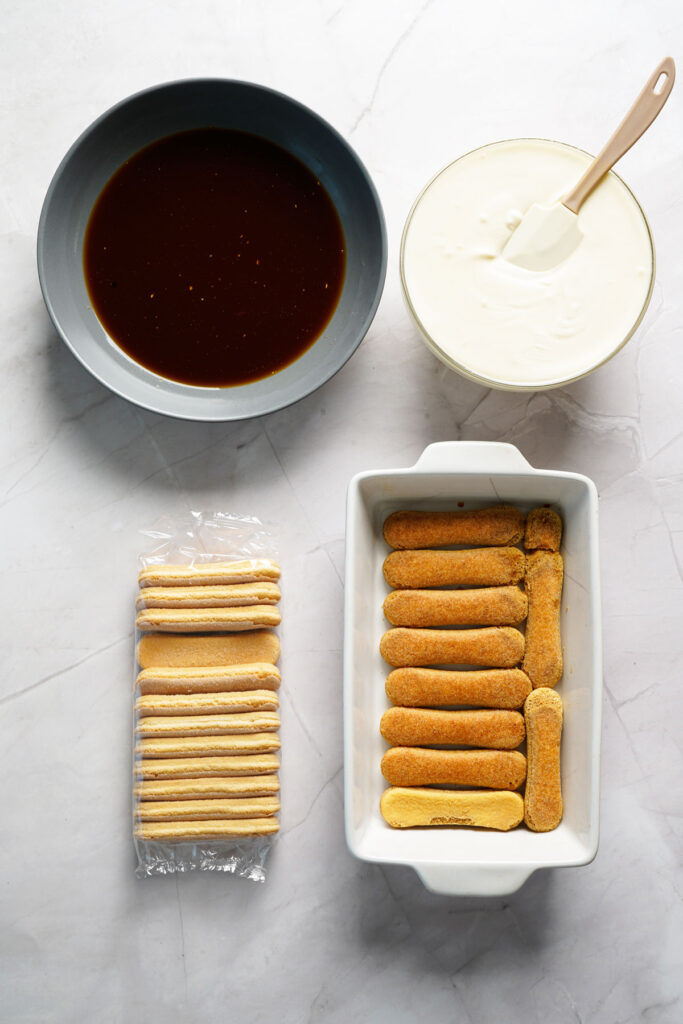 ladyfingers in serving dish to make tiramisu