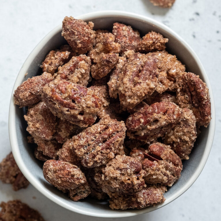 sugared pecans in white bowl