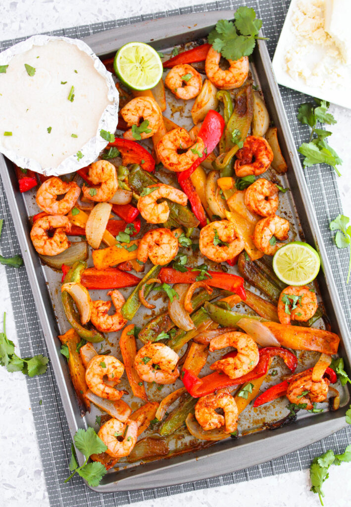 sheet pan with roasted onion, peppers, and shrimp