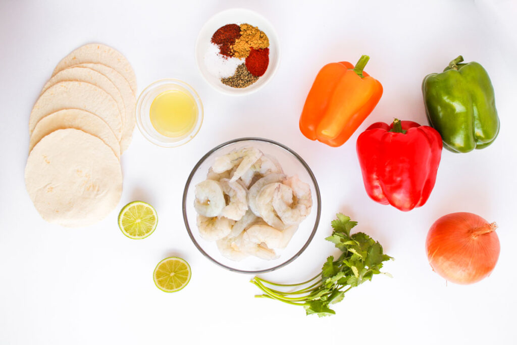 sheet pan shrimp fajita ingredients on countertop