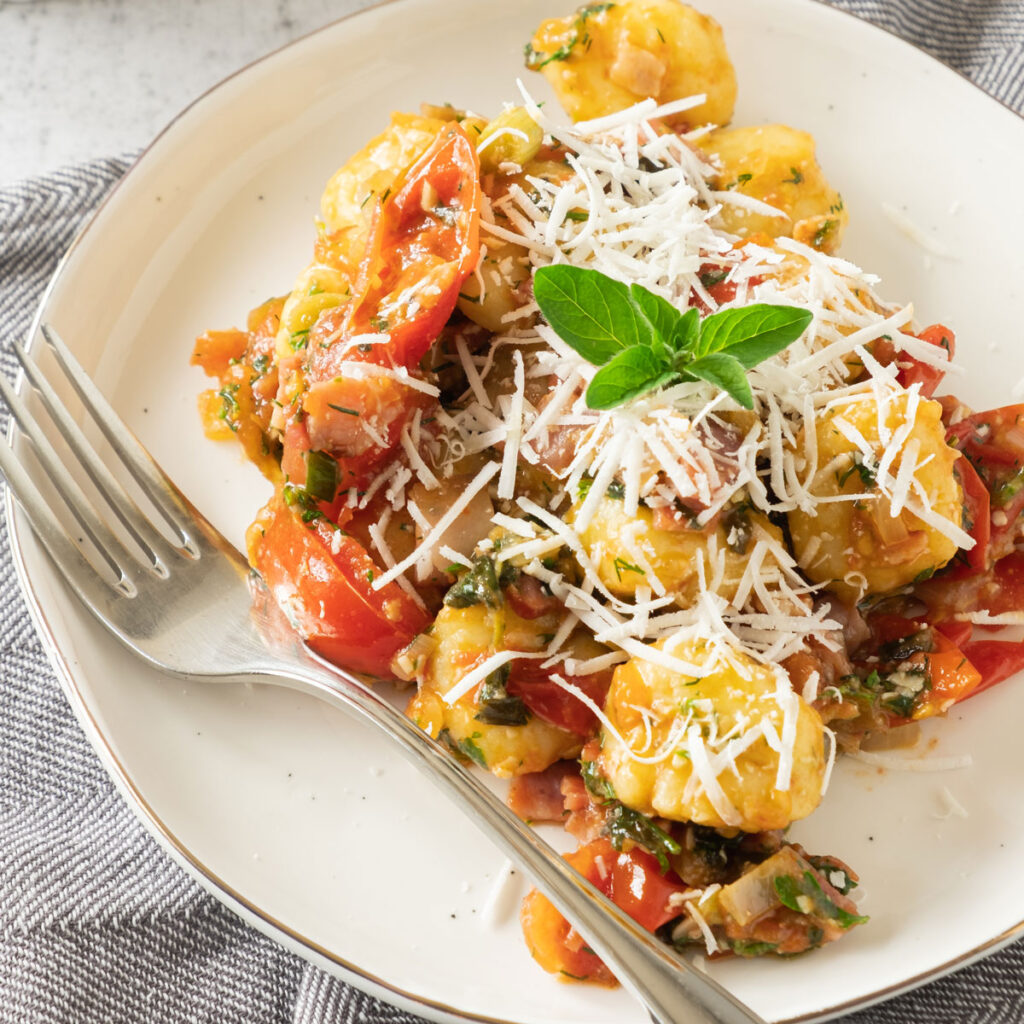 bacon gnocchi on white plate