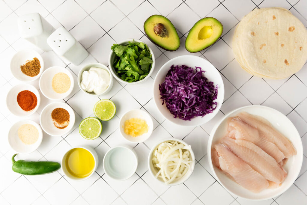blackened fish tacos ingredients in bowls on countertop