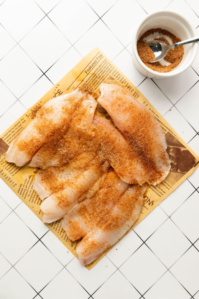 fish fillets with blackening seasoning before cooking