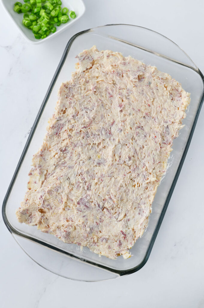 reuben dip in glass baking dish before baking