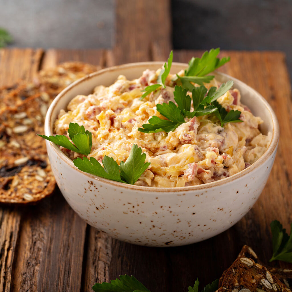 reuben dip in bowl on cutting board