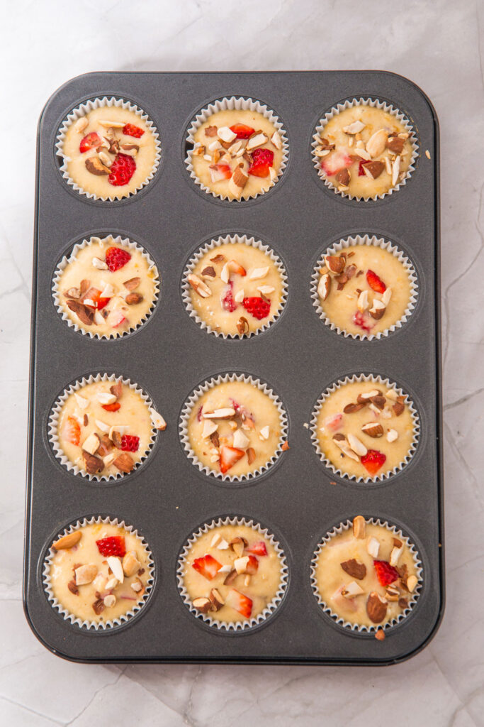 strawberry banana muffin s in muffin tin before baking