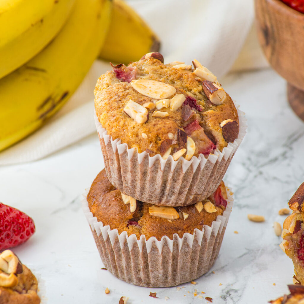 two strawberry banana muffins stacked