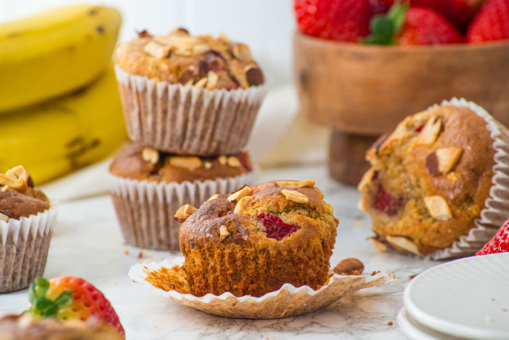 3 strawberry banana muffins with one wrapper removed