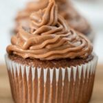 nutella frosting on a cupcake with recipe name overlay