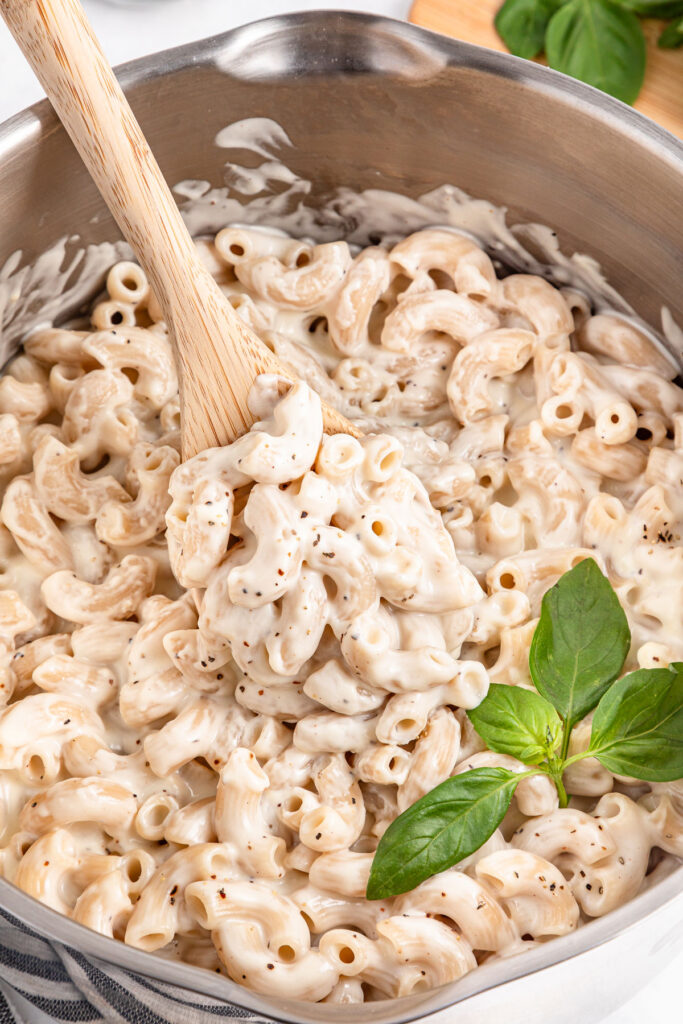 elbow pasta in bechamel sauce in pot