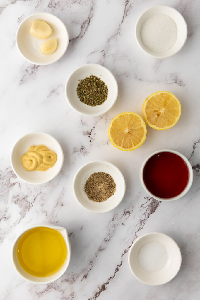 italian dressing ingredients in bowls on counter