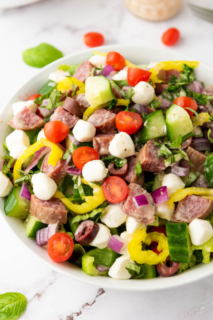 close up of Italian chopped salad in white bowl