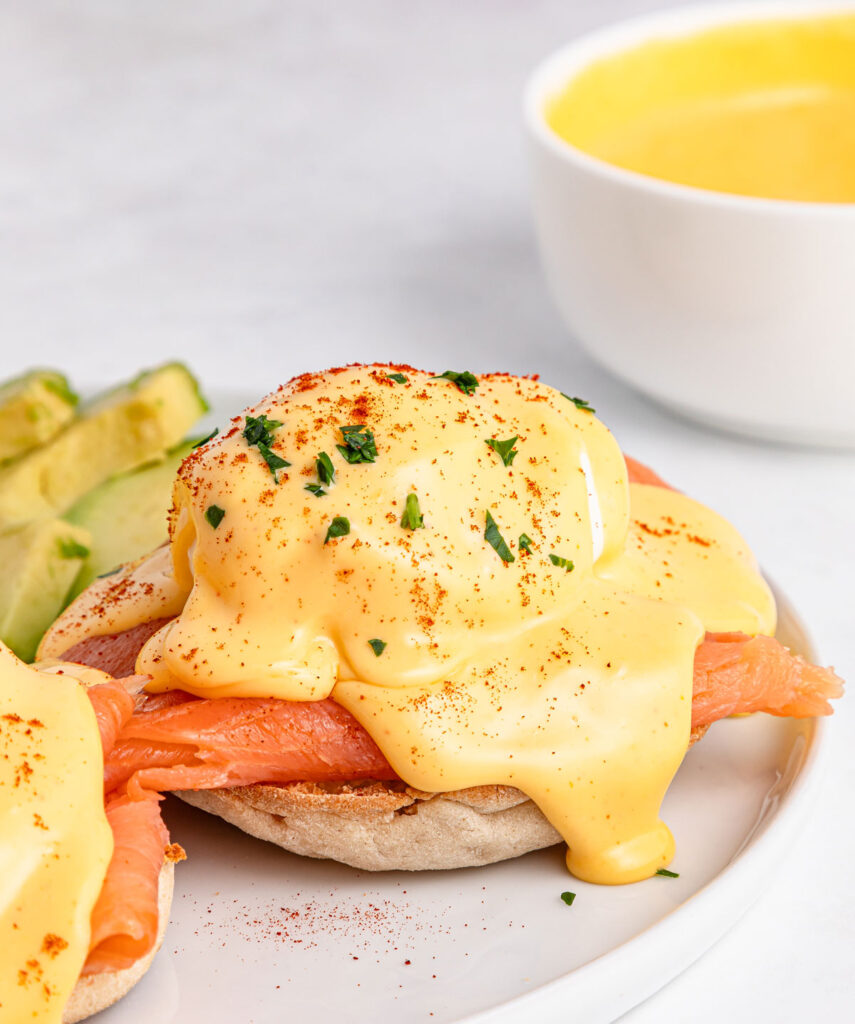 smoked salmon eggs benedict on white plate