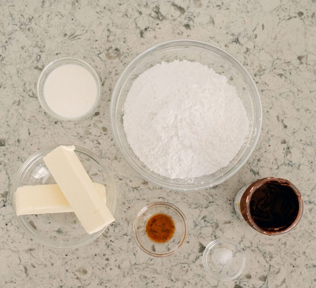 nutella frosting ingredients in bowls on counter