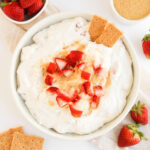 overhead view of strawberry cheesecake dip with graham crackers
