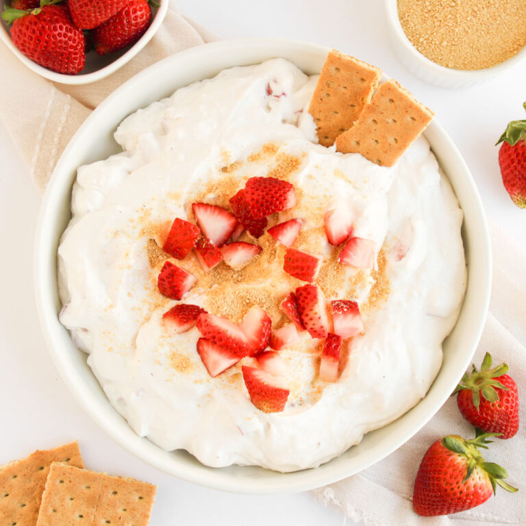 overhead view of strawberry cheesecake dip with graham crackers