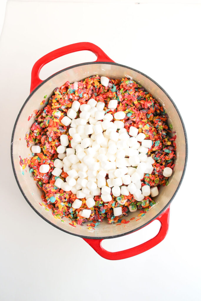 Fruity Pebbles and marshmallows in dutch oven to make Rice Krispies Treats