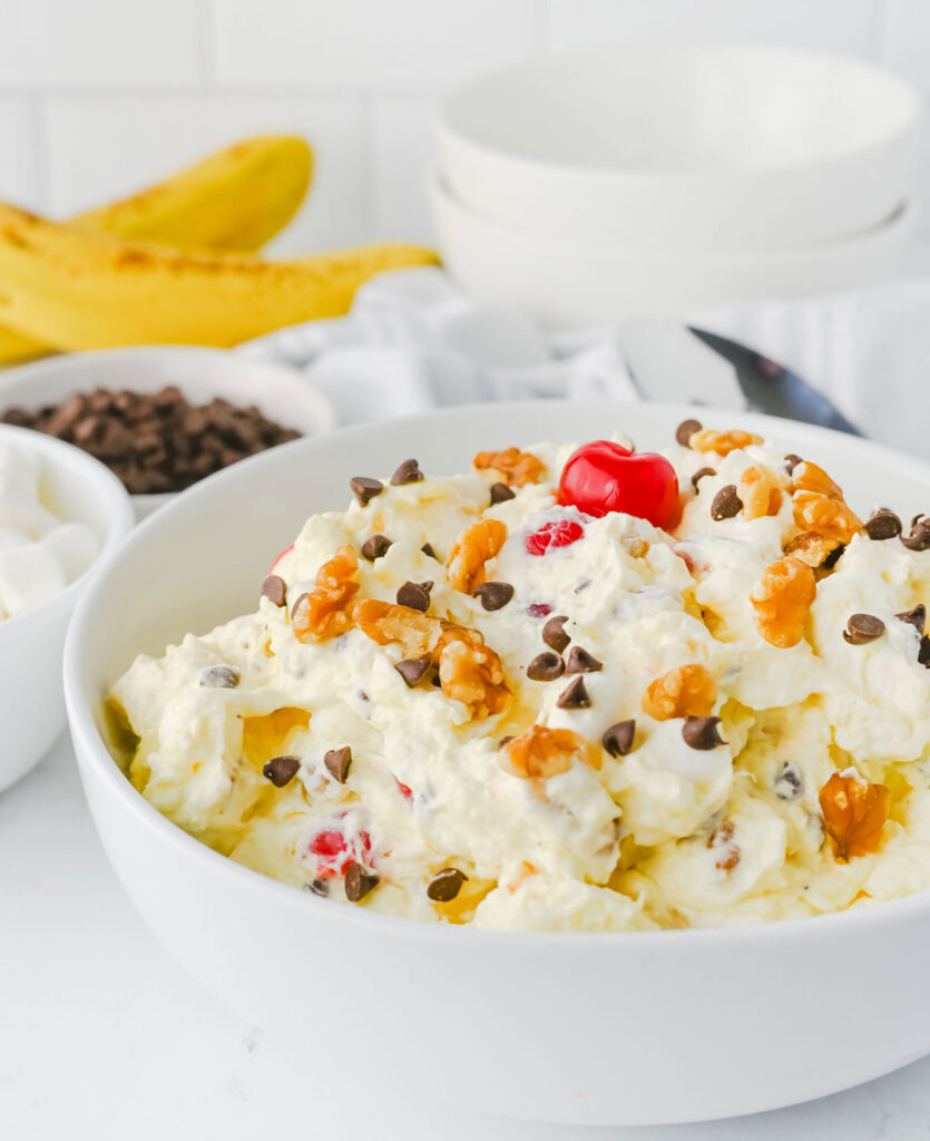 banana split fluff salad in white bowl
