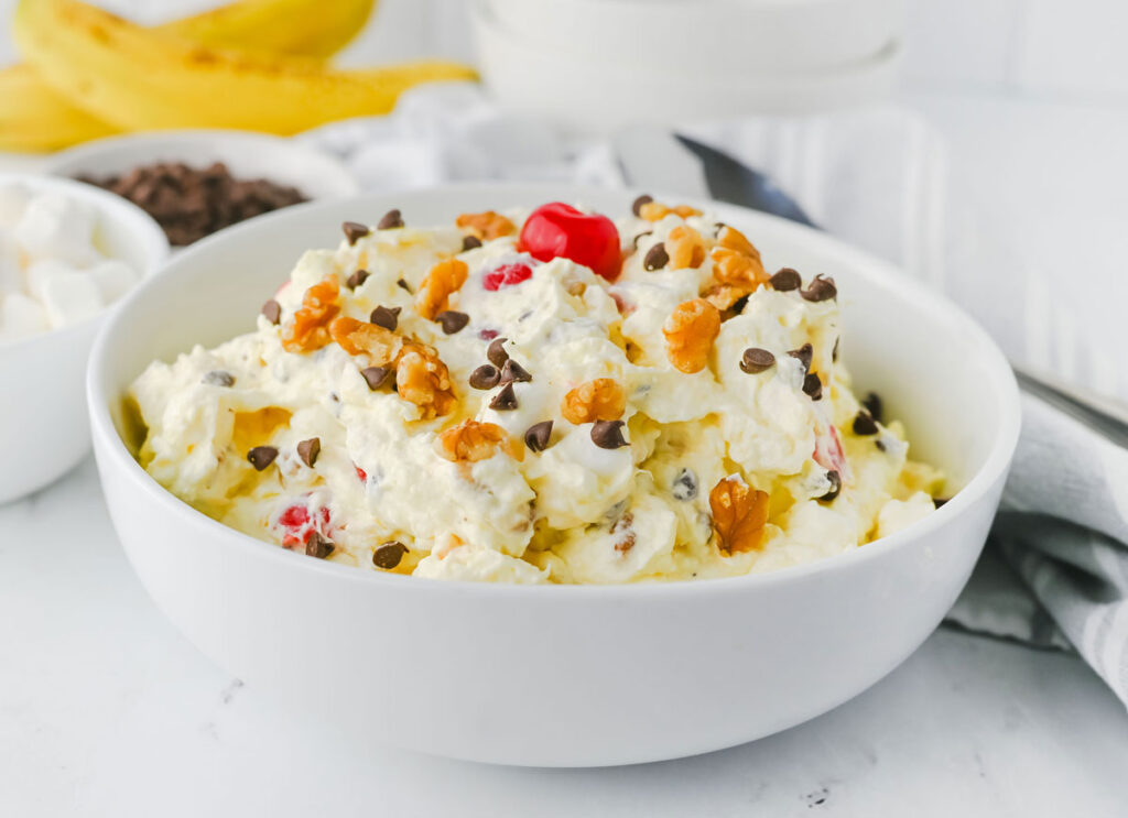 banana split fluff salad in white bowl
