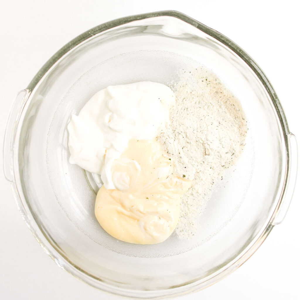 mayo and seasonings in glass bowl