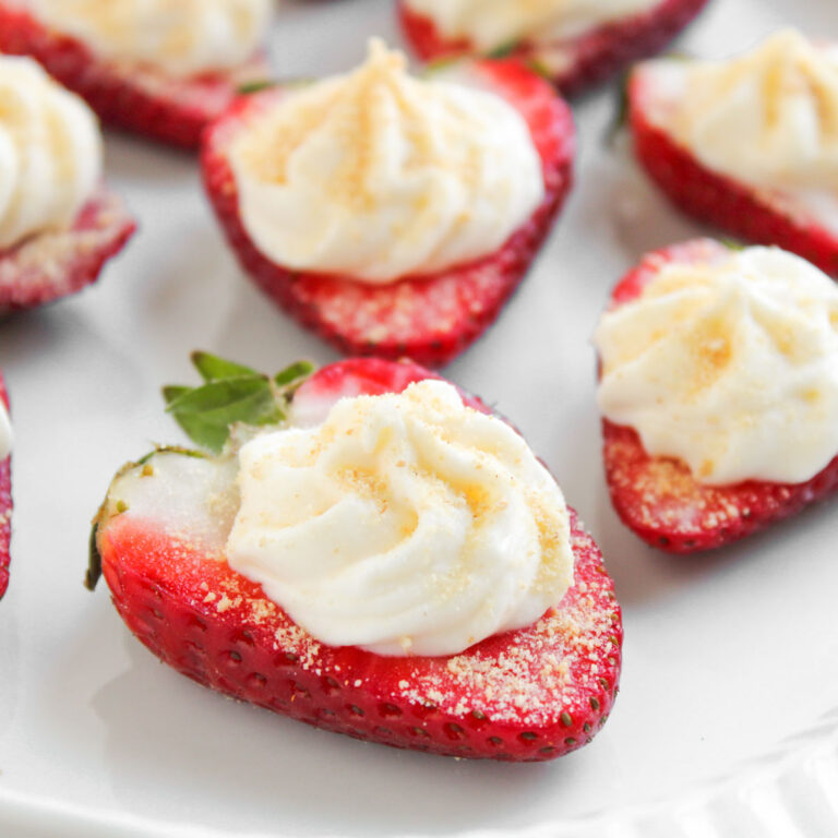close up of deviled strawberries on plate