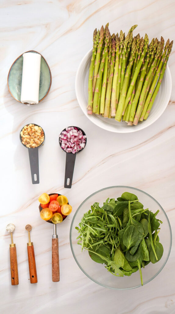 goat cheese asparagus salad ingredients on countertop
