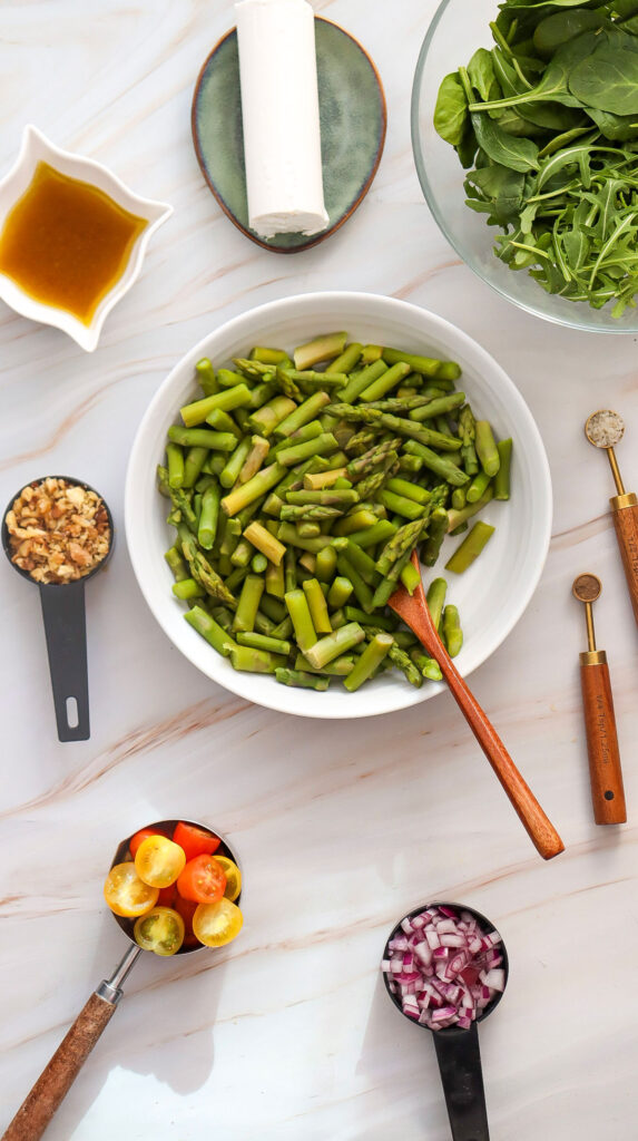 chopped asparagus in bowl for goat cheese asparagus salad