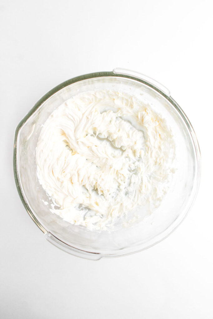 whipped cream cheese in glass bowl