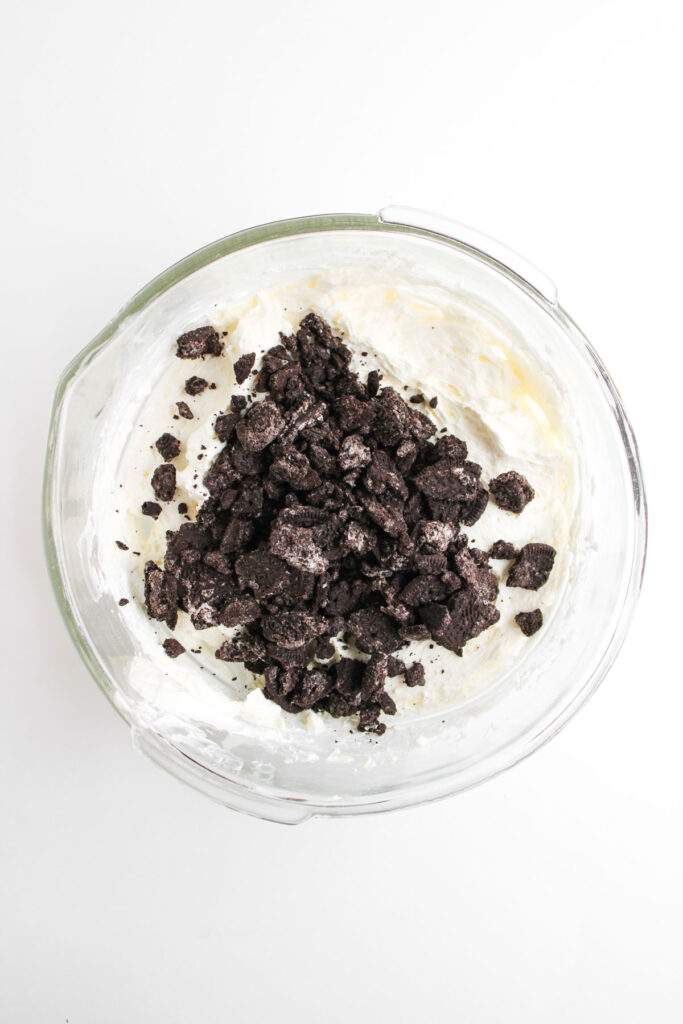 crushed oreos on top of oreo cheesecake dip
